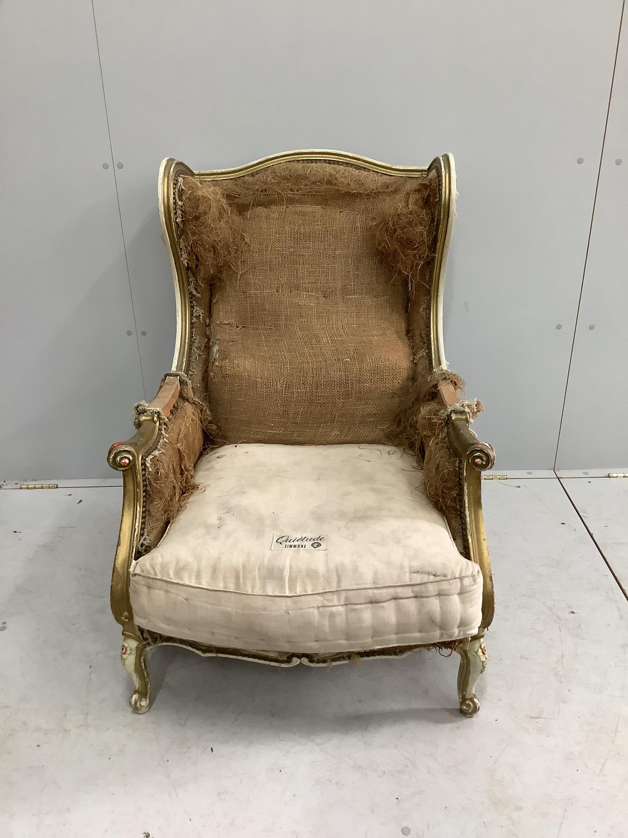 A 19th century French painted parcel gilt armchair requiring re-upholstery, width 69cm, depth 84cm, height 94cm